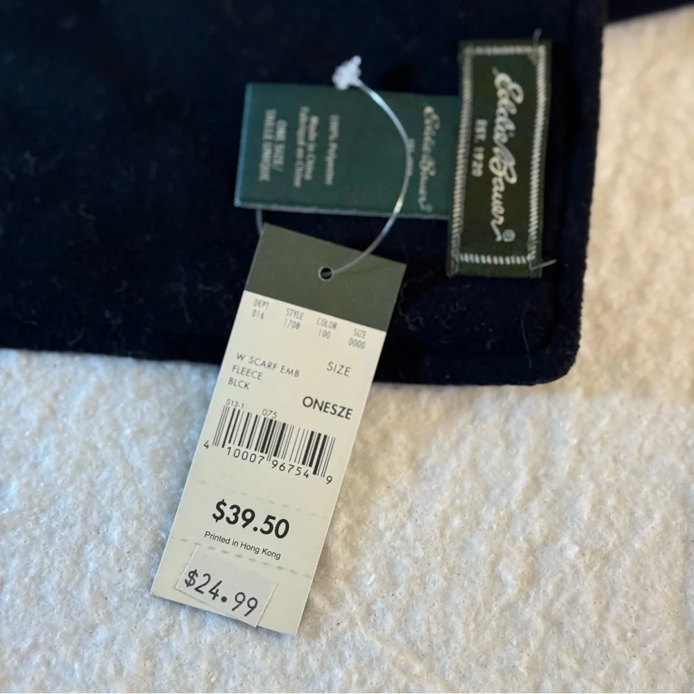 Eddie Bauer finely woven‎ fleece scarf in black with a quilted accent. 64” x 9”